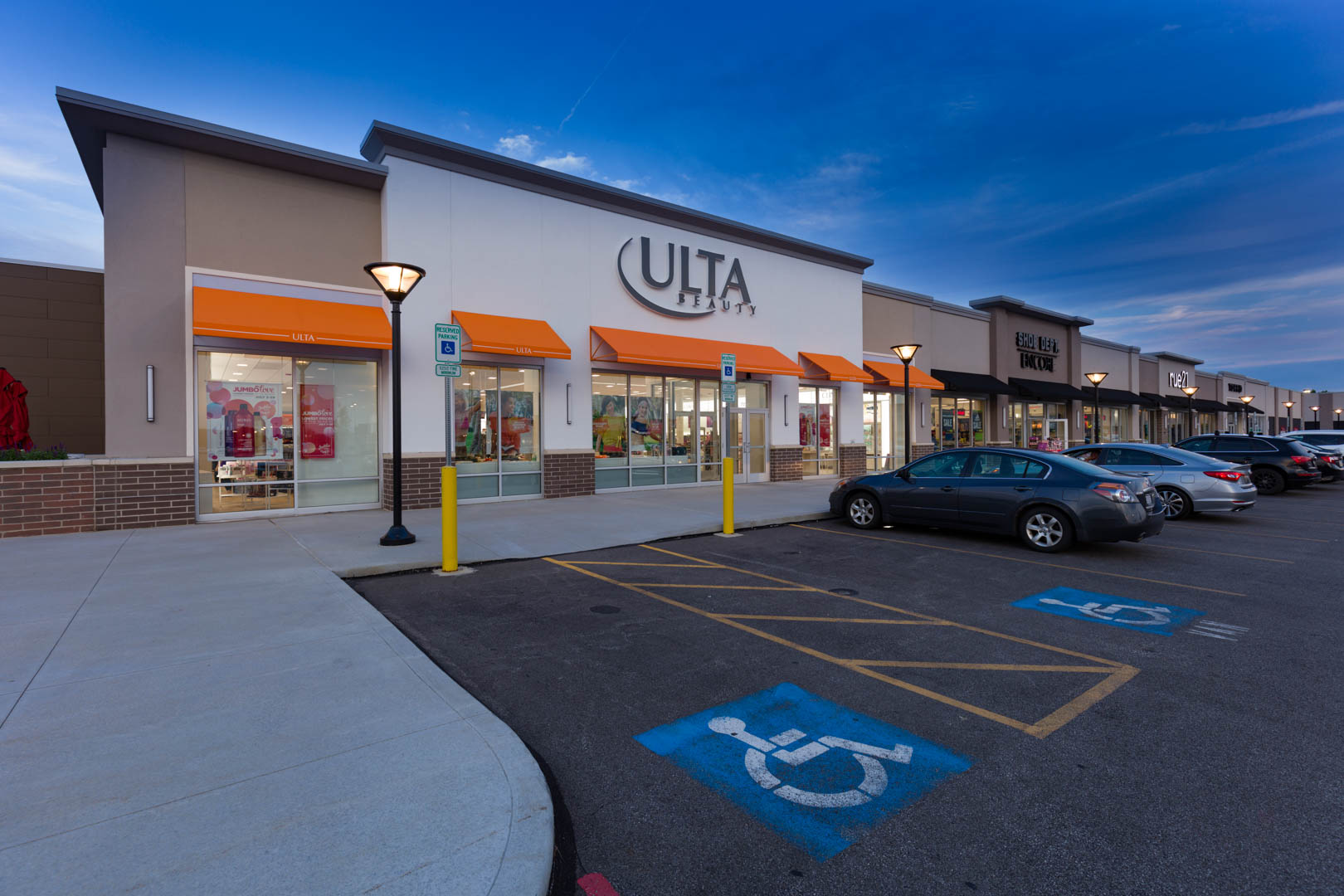 Exterior view of retail tenants at night