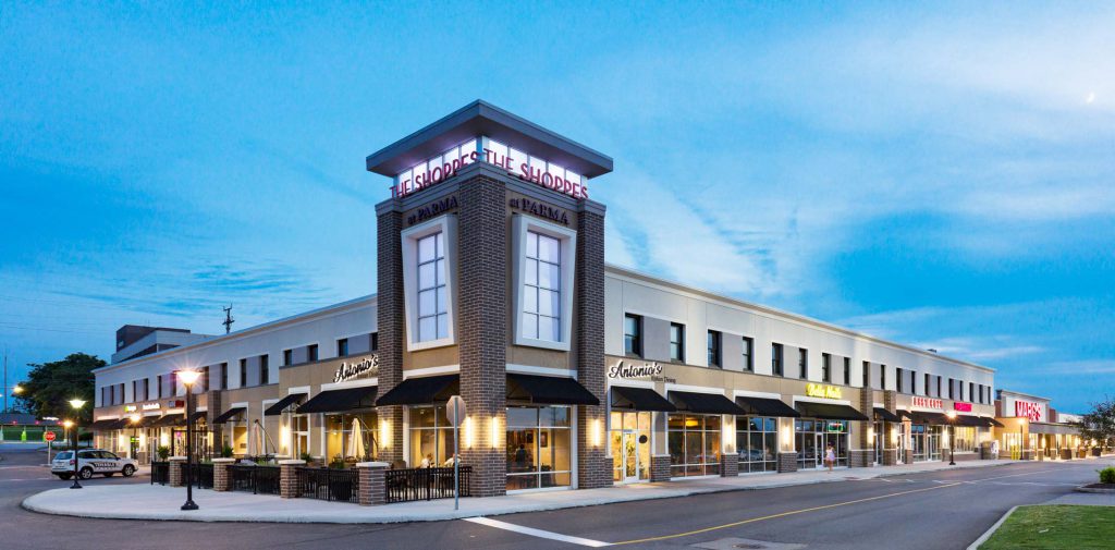 Exterior view of retail tenants at night