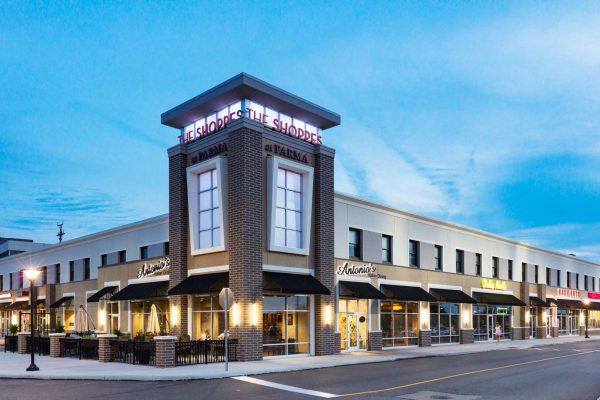 Exterior view of retail tenants at night