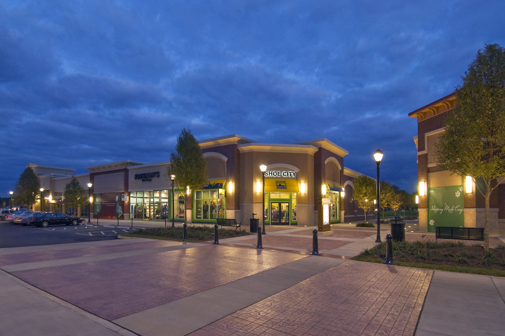 Exterior view of retail tenants at night