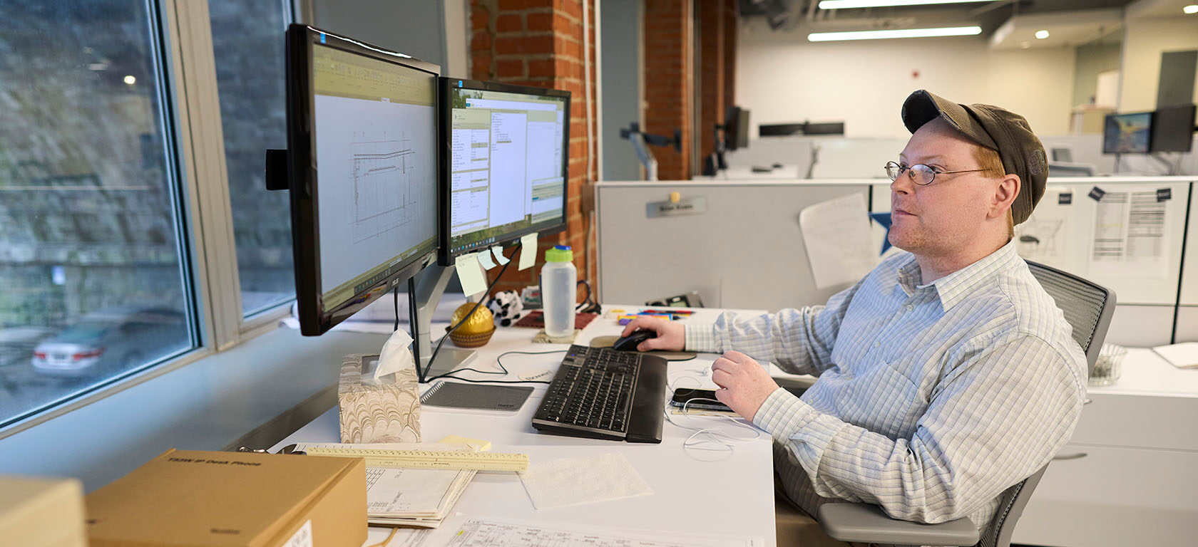 man at desk with computer