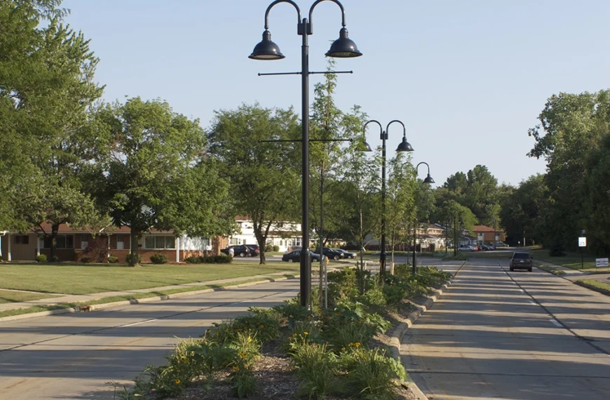 A daytime image of suburban street in North Olmsted Ohio with a median containing streetlights in the middle. From Bowen Municipal Engineering